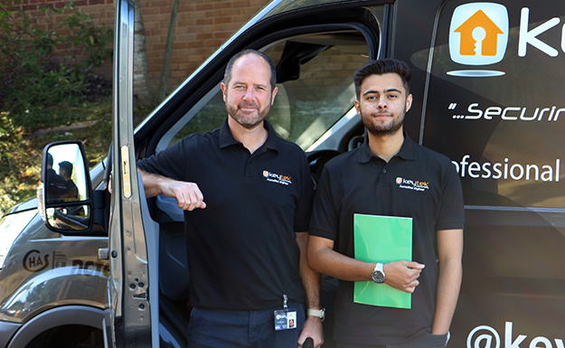 Find a locksmith, two locksmiths stand outside Keytek van